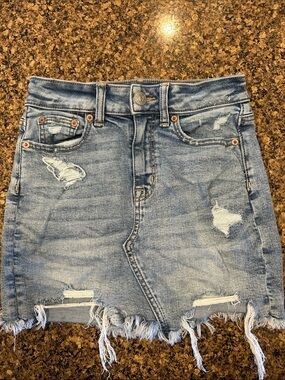 American Eagle Outfitters Light Blue Distressed Denim Mini Skirt with Frayed Hem